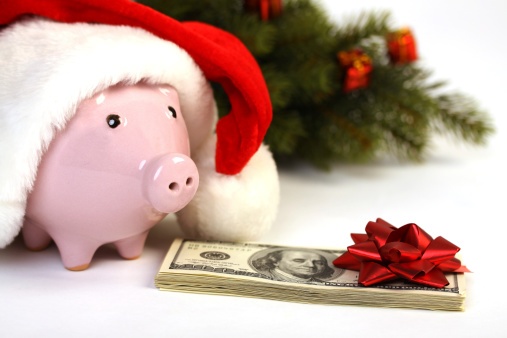 Piggy bank in a Christmas hat to save money